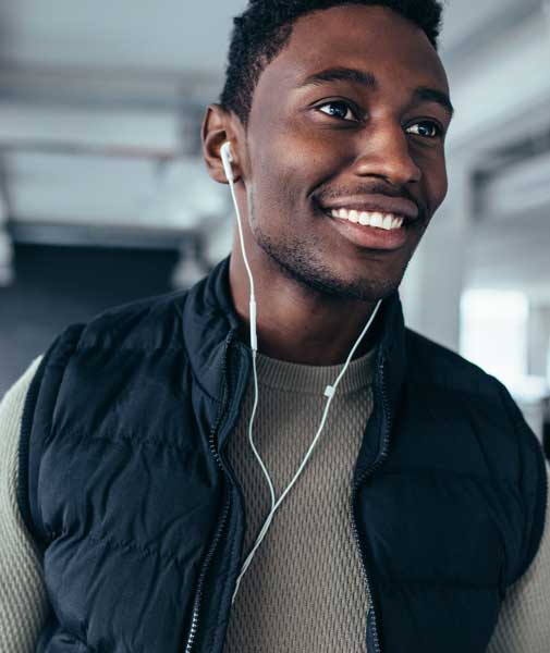 smiling black man with earphones